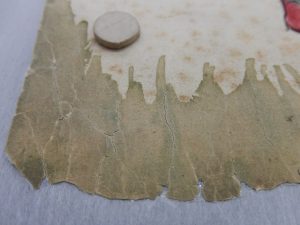 Large area of embrittled paper after repairs. Large area of embrittled paper after repairs.