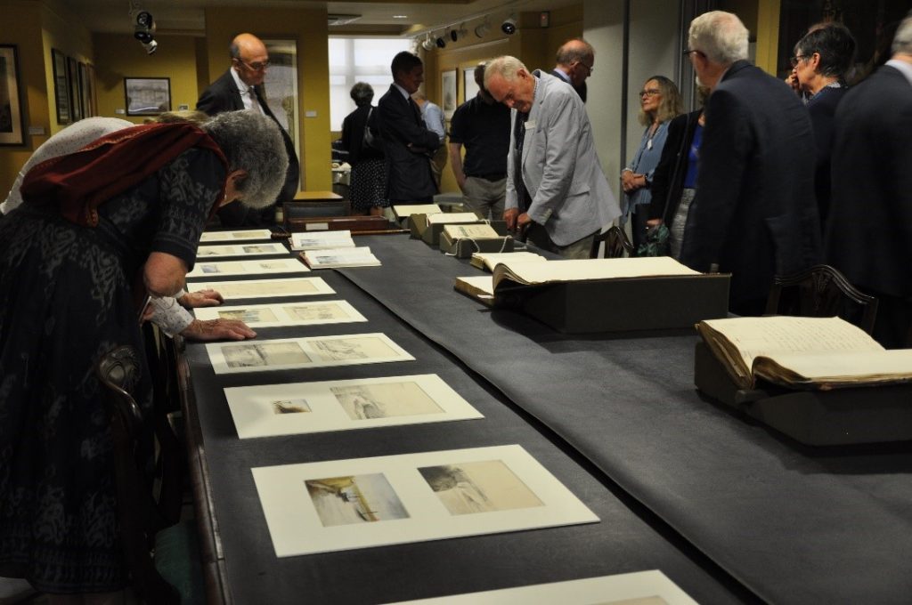 Members from MECAS exploring some of the Society’s collections on display in the Council Room.